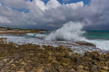 Fototapeta na wymiar Rocky formation on the Caribbean shore in Mexico, Isla Mujeres.