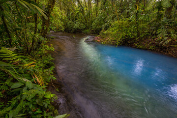 Two clear rivers with different acidity mix and create the river with turquoise water. Rio Celeste, Costa Rica
