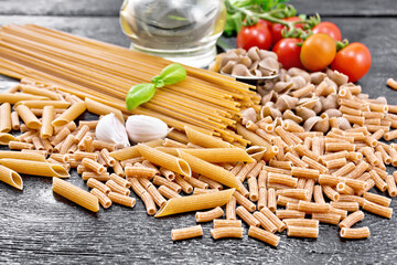 Pasta different whole grain and rye on wooden board