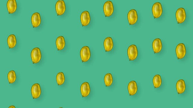 Colorful fruit pattern of fresh mango on green background. Seamless pattern with mango. Realistic animation. 4K video motion