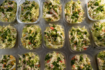 food delivery. top view of organic healthy salad in disposable bowl. Clean food concept, healthy food, takeaway fitness food in plastic boxes.