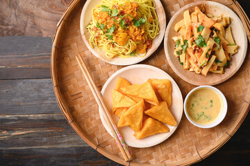 Deep fried Burmese tofu, spicy fresh Burmese tofu salad and noodles, Tai Yai food in Northern of Thailand, Table top view