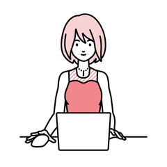 デスクで座ってPCを使っているドレスの女性