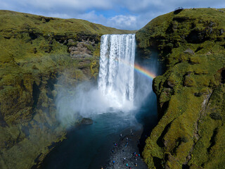 Beautiful aerial view of the huge Skogafoss waterfall and its rainbow in summer. Icelands Waterfal