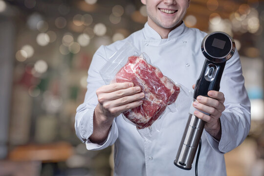 A cook wrapped in a vacuum with meat and a device for cooking with a low temperature .