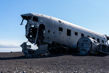 Impressive view of the Sólheimasandur Plane Wreck, the Remains of a 1973 U.S. Navy DC plane that crashed on black sand beach in Iceland