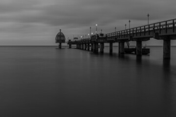 Fototapeta na wymiar Long Exposure of a Jetty pier with calm sea, Zingst, Germany