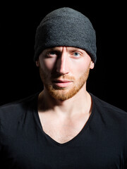 Brutal man, handsome serious male model. Close up portrait of guy with serious profile face on...
