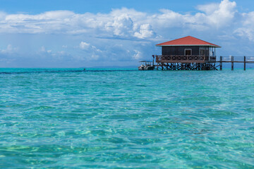 Mantabuan island with turquoise water on a sunny day, Borneo