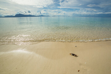 Crab on a beautiful beach with turquoise water Sibuan island, Borneo