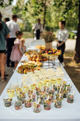 Wedding cake table background. Sweet and delicious restaurant desserts. Tasty food on buffet party.