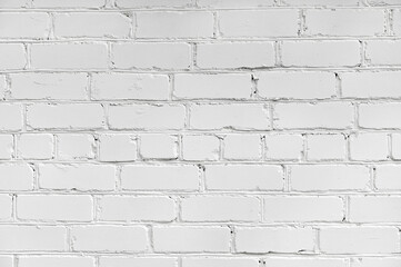 The background of the wall is made of white brick.