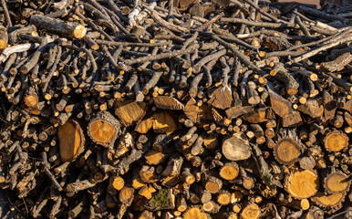 Pile of stacked triangle firewood prepared for fireplace and boiler