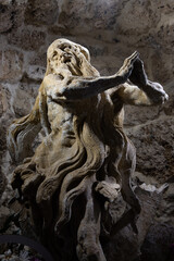 Fototapeta na wymiar Stone sculpture of St. Onuphrius, Rukomysh. Written by Pinzel