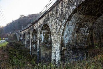 Fototapeta na wymiar Old stone arched bridge-viaduct, Ternopil region, Ukraine