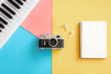 Vintage retro camera on a colored background, flat lay, minimalism.