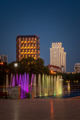 Obraz premium Сolored illuminated fountains and modern buildings in the center of Yekaterinburg city at summer night
