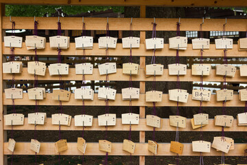 Traditional wooden plaques with prayers in Meiji Shrine