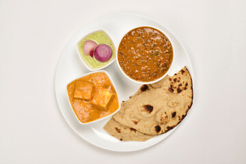 Dal Makhani and Shahi Paneer Served with Roti in Plate isolated on white background