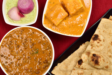 Main Course Indian Cuisine , Paneer Butter Masala, Dal Makhani with Tandoori Roti Served with Pudina chutney onion