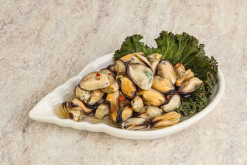 Tasty marinated mussels in the bowl