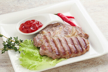 Grilled pork neck steak with ketchup