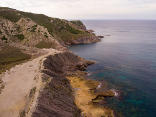 Fototapeta na wymiar Capo Argentiera ,Sardinia, aerial view of the trekking along the coast