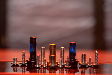 Fototapeta na wymiar some screws are arranged to resemble a city building