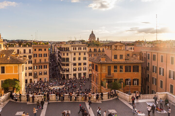 The Spanish Steps and Piazza di Spagna (Spain Square) with famous Fontana della Barcaccia (Fountain of the Ugly Boat) at sunset in Rome, Italy