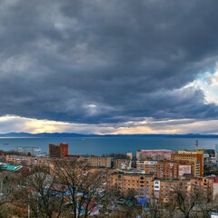 view of the city at sunset from hill