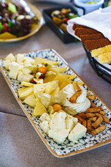 a plate of cheese assorted. traditional appetizer. cheese factory.