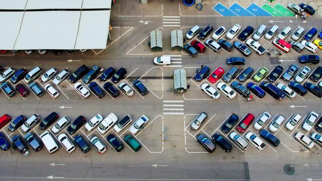 Aerial top view from drone of parking lot of the business center, hyper lapse