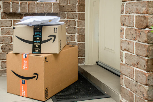 Sydney, Australia - 2021-12-03 Amazon prime boxes and envelopes delivered to a front door of residential building