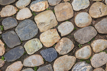 Old rounded cobblestone pavement in old town of Freiburg im Breisgau, Baden-Wuerttemberg, Germany