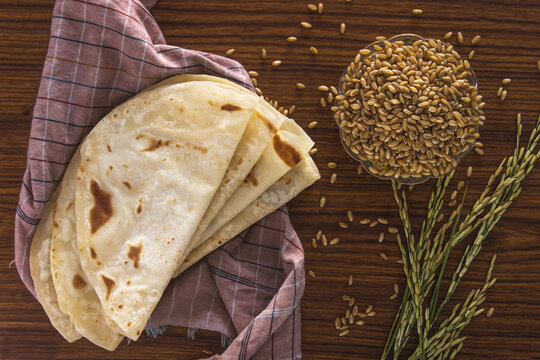chapathi on a wooden background  and peddy in cup