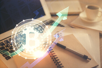 Double exposure of crypto technology drawing and desktop with coffee and items on table background....