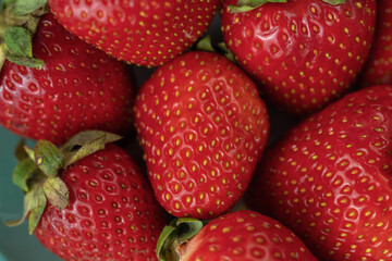 Ripe red strawberries on a plate