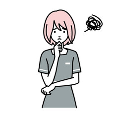 立って手をあごにあてて困っているエステ店員の女性