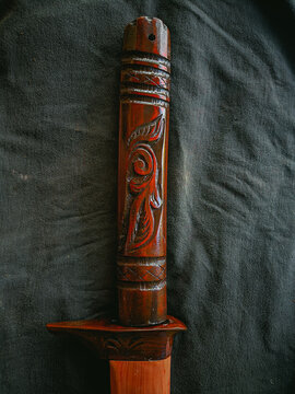 Detail carving hilt sword on a black background