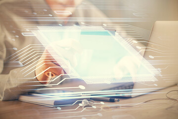 Double exposure of man hands holding a credit card and data theme drawing. E-commerce and technology concept.