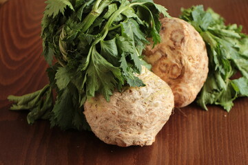 Celery root with leaf. Healthy food. Whole celeriac with leaves. Celery root to prepare vegetable...
