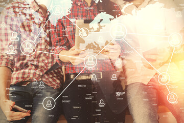 Double exposure of social network theme drawing and man and woman working together holding and using a mobile device.