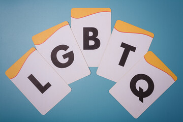 LGBTQ letters on blue background. Tolerance, pride month concept. Respect to every kind of love, diversity, human rights.