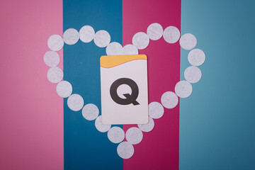 Letter Q on lgbtq symbolic background. Queer or questioning, gender-neutral, non-binary and agender...