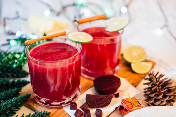 Beetroot and pineapple smoothie in glasess for dinner, party, celebrate or Christmas new year healthy drink