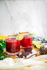 Beetroot and pineapple smoothie in glasess for dinner, party, celebrate or Christmas new year healthy drink. vertical photo