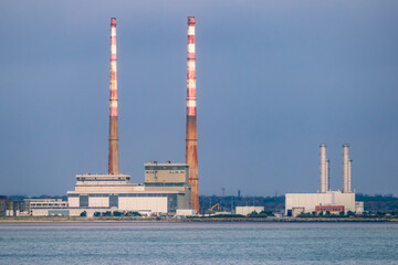 Obraz premium Dublin, Ireland, November 12, 2021: The iconic Chimneys of Poolbeg Generating Station