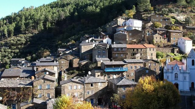 DRONE AERIAL FOOTAGE: The picturesque little schist villages of Piod&atilde;o clings to a steeply terraced mountainside deep within the foothills of the Serra de A&ccedil;or range in central Portugal. 