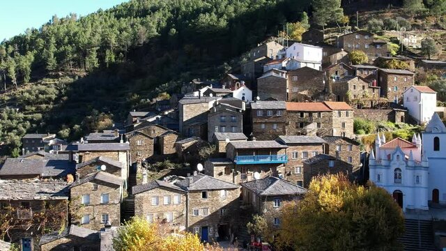 DRONE AERIAL FOOTAGE: The picturesque little schist villages of Piod&atilde;o clings to a steeply terraced mountainside deep within the foothills of the Serra de A&ccedil;or range in central Portugal. 