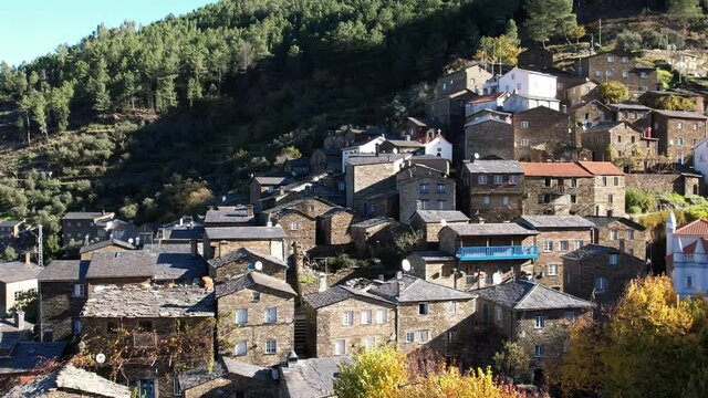 DRONE AERIAL FOOTAGE: The picturesque little schist villages of Piod&atilde;o clings to a steeply terraced mountainside deep within the foothills of the Serra de A&ccedil;or range in central Portugal. 
